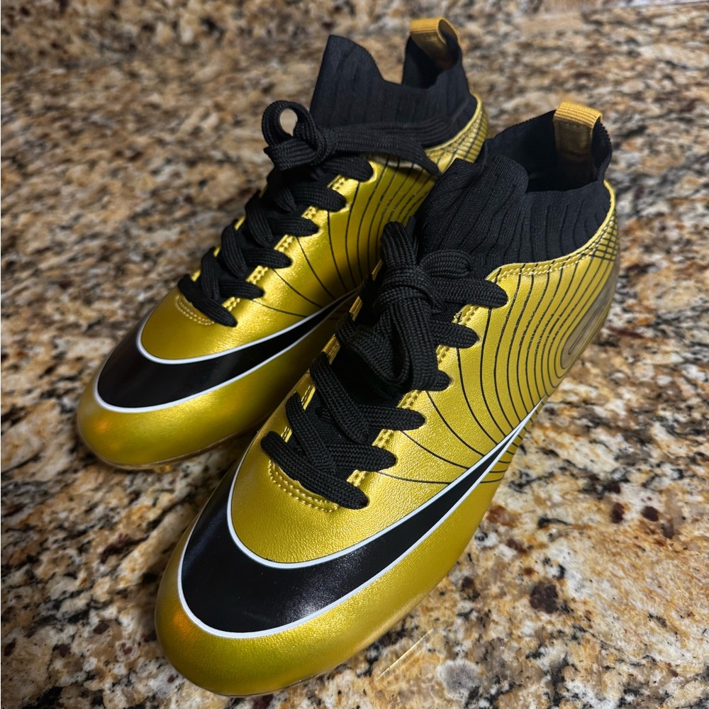 Gold and Black Soccer Cleats